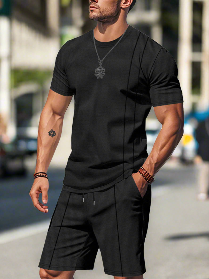 Man wearing a black shorts set on a city background