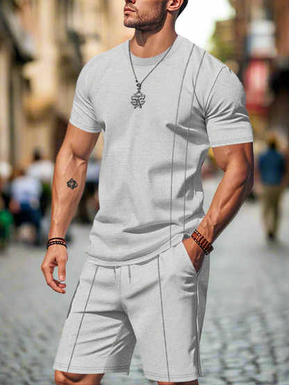 Man wearing a gray shorts set on a white background